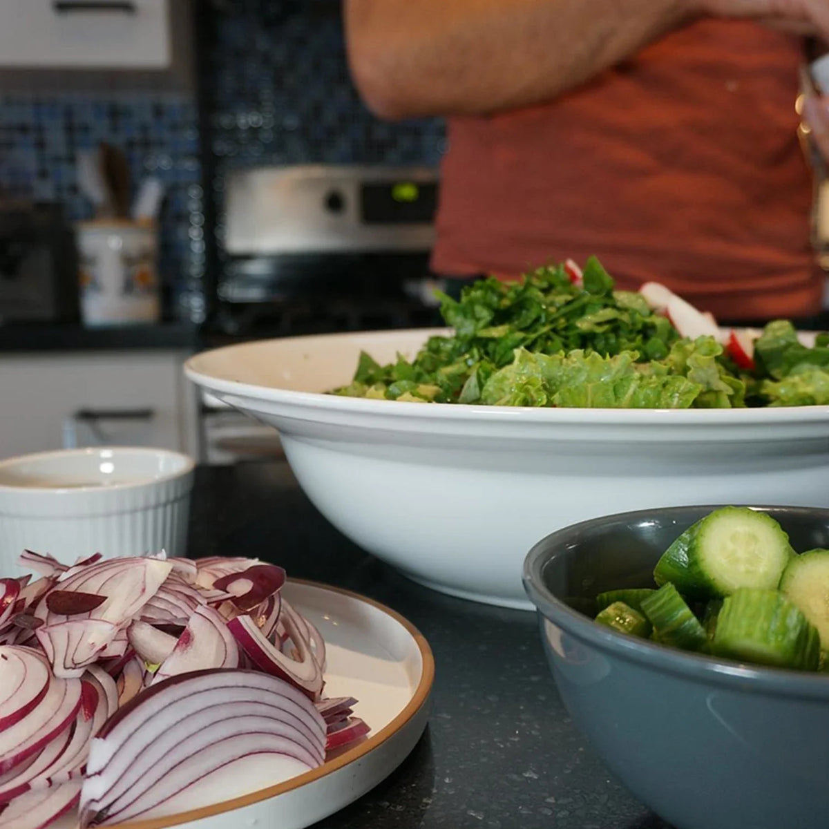 A fresh Mediterranean salad with floral and fragrant herb dressing